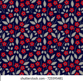 Floral background in vintage style. Decorative embroidery flowers. Vector seamless pattern. Ornament for textiles on blue background. Small red flowers. The elegant the template for fashion prints