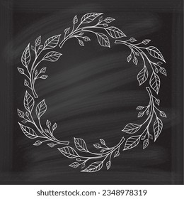 Floral decoratare frame on a chalkboard background. Monogram, wedding invitation or greeting card template. 