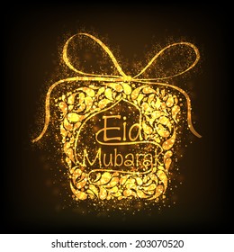 Floral decorated golden gift box on brown background for Muslim community festival Eid Mubarak celebrations. 