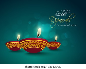 Floral decorated illuminated oil lit lamps on shiny background for Indian Festival of Lights, Happy Diwali celebration.