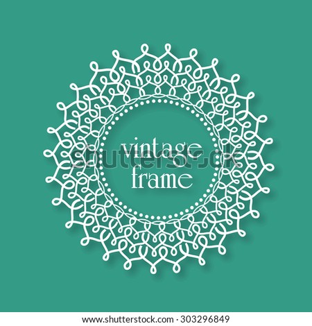 Floral design decorated beautiful rounded vintage frame on green background