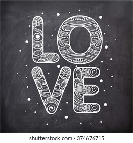 Floral design decorated stylish text Love on vintage chalkboard background for Happy Valentine's Day celebration.