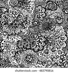 Floral doodle seamless wallpaper pattern. Illustration with paisley ornaments. Textile with hand-drawn flowers. Black and white color.