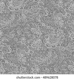 Floral doodle seamless wallpaper pattern. Illustration with paisley ornaments. Textile with hand-drawn flowers.