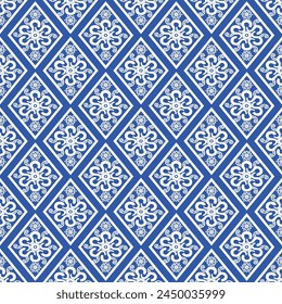Floral elegant pattern. Blue and white ceramic seamless pattern. Porcelain rhombus shape pattern background design. Great for wallpaper, gifts, tile, textile, tableware, packaging design.