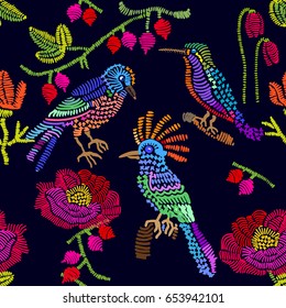 Floral embroidery. Seamless vector pattern with birds, berries and flowers. Vintage motifs. Retro textile design collection. Colorful on dark.