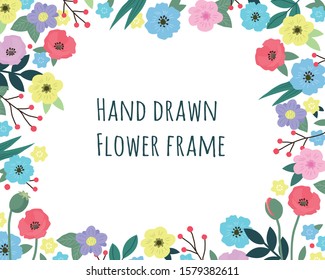 Floral frame decorated with colorful cute hand drawn wild flowers, leaves and berries with copy space. Design for wedding invitations, posters, birthday and womans day. Vector spring seasonal border