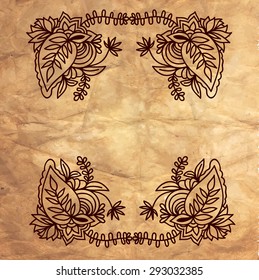 Floral frame on aged paper texture.