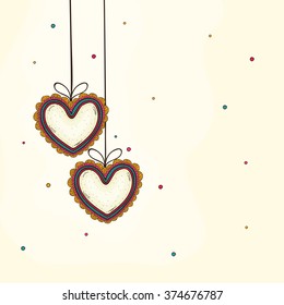 Floral hanging hearts decorated greeting card for Happy Valentine's Day celebration.