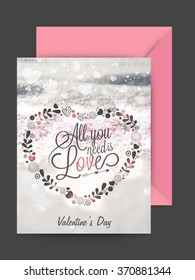 Floral heart decorated greeting card design with pink envelope for Happy Valentine's Day celebration.