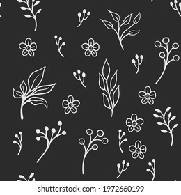 Floral and herbal ornaments seamless pattern. Hand drawn leaves and branches texture background. Nature doodles decoration.