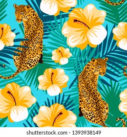 Floral jungle leopard seamless pattern.  Animal print pattern with tropical leaves and flowers in turquoise background.