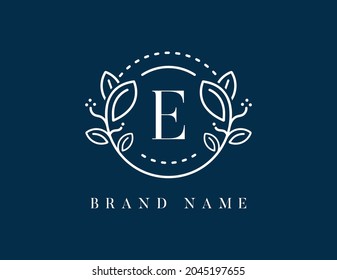 Floral logo with letter E. Vector logo template