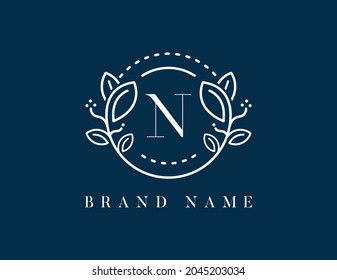 Floral logo with letter N. Vector logo template