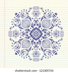 Floral mandala drawn with blue ink on paper