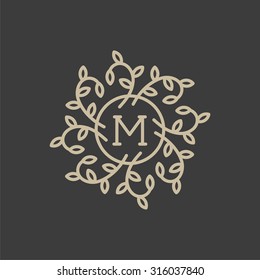 Floral monogram design template with letter M