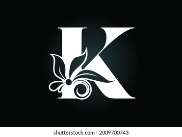 Floral monogram letter K. Initial alphabet with botanical elements. Font emblem. Vector illustration for wedding invitations, greeting cards, logos, posters, and other designs.