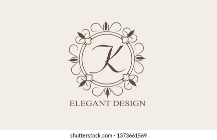 Floral monogram with the letter K. Stylish logo design of the menu, labels, restaurant, hotel, heraldry, jewelry, boutique. Vector illustration.