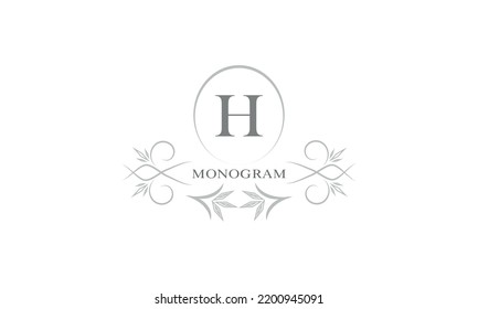 Floral monogram template and letter H. Template for cards, invitations, menus, labels. Graphic design of pages, business signs, boutiques, cafes, hotels.