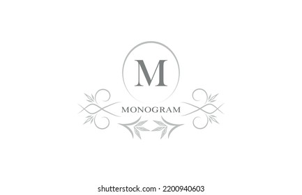 Floral monogram template and letter M. Template for cards, invitations, menus, labels. Graphic design of pages, business signs, boutiques, cafes, hotels.