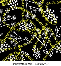floral ornament and white dots on a dark colored background with golden chains