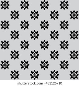 Floral pattern with alternate black and white flowers on grey background