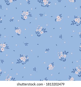 Floral pattern. Beautiful flowers on a light blue background. Print with pale pink flowers. Seamless vector texture. Spring bouquet.