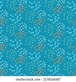 Floral pattern. Beautiful small colorful flowers on a blue background. Ditsy stamp. Seamless texture