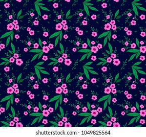 Floral pattern. Pretty flowers on dark blue background. Printing with small pink flowers. Ditsy print. Seamless vector texture. Spring bouquet.