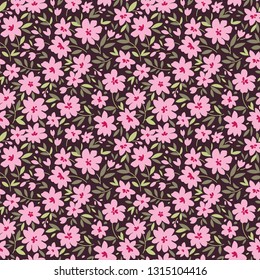 Floral pattern. Pretty flowers on dark violet background. Printing with small pink flowers. Ditsy print. Seamless vector texture. Spring bouquet.