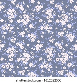 Floral pattern. Pretty flowers on pale gray background. Printing with small white flowers. Ditsy print. Seamless vector texture. Spring bouquet.