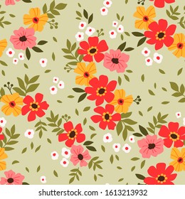 Floral pattern. Pretty flowers on light green background. Printing with small red and yellow flowers. Ditsy print. Seamless vector texture. Spring bouquet.