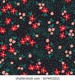 Floral pattern. Pretty flowers on black background. Printing with small red and pink flowers. Ditsy print. Seamless vector texture. Spring bouquet.