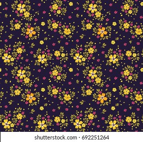 Floral pattern. Pretty flowers on dark blue background. Printing with small yellow flowers. Ditsy print. Seamless vector texture. Spring bouquet.