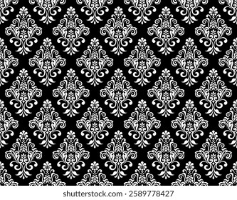 Floral pattern. Seamless vector background. Vintage wallpaper in the Baroque style. White and black ornament for fabric, wallpaper, packaging. Ornate Damask flower illustration.