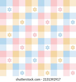 Floral pattern for spring summer. Colorful pastel abstract vichy tartan check plaid with daisy flowers in blue, pink, yellow, white for gift paper, tablecloth, picnic blanket, fashion textile print.