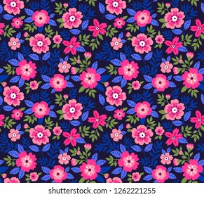 Floral pattern vintage style. Small pink flowers and leaves. Modern surface dark blue background. A bouquet of spring flowers for fashion prints. Trendy floral print.