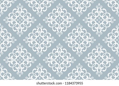 Floral pattern. Vintage wallpaper in the Baroque style. Seamless vector background. White and blue ornament for fabric, wallpaper, packaging. Ornate Damask flower ornament