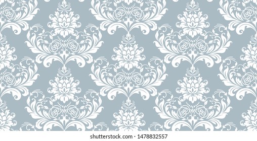 Floral pattern. Vintage wallpaper in the Baroque style. Seamless vector background. White and blue ornament for fabric, wallpaper, packaging. Ornate Damask flower ornament