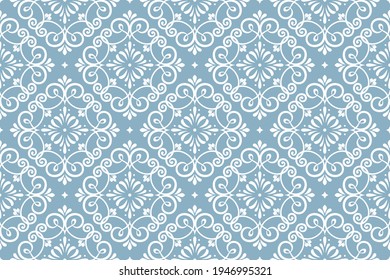 Floral pattern. Vintage wallpaper in the Baroque style. Seamless vector background. White and blue ornament for fabric, wallpaper, packaging. Ornate Damask flower ornament