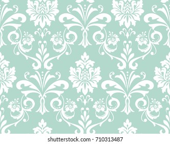 Floral pattern. Wallpaper baroque, damask. Seamless vector background. Green and white ornament