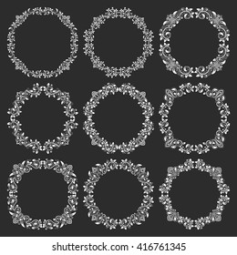 Floral patterned round frames set for design in victorian vintage style. White circular wreaths on black background. Vintage floral round frames.