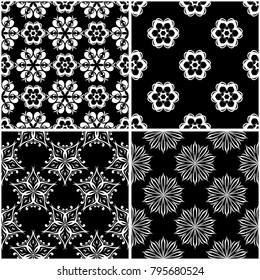 Floral patterns. Set of black and white monochrome seamless backgrounds. Vector illustration