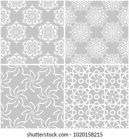 Floral patterns. Set of gray and white monochrome seamless backgrounds. Vector illustration