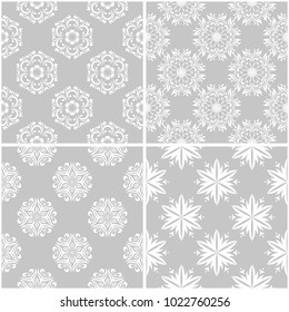 Floral patterns. Set of gray and white monochrome seamless backgrounds. Vector illustration