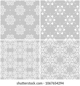Floral patterns. Set of gray and white monochrome seamless backgrounds. Vector illustration