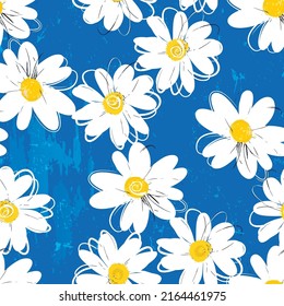 floral seamless background pattern, with abstract flowers, daisies, paint strokes and splashes, on blue