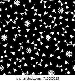 Floral seamless black and white pattern with flowers and buds. Lace background for fabric, porcelain, paper. White flowers on a black background.