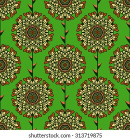 Floral seamless pattern with beautiful yellow graphic flowers on green background
