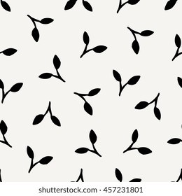 Floral seamless pattern in black on cream background.
